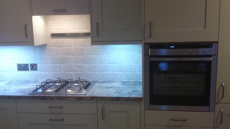 Shaker Wood Blue kitchen fitted with laminate worktops