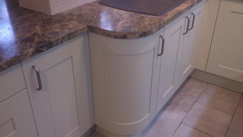 Shaker Wood Blue kitchen fitted with laminate worktops