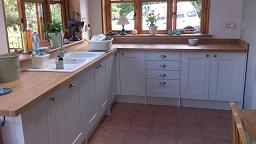Shaker Wood white Kitchen with laminate worktops